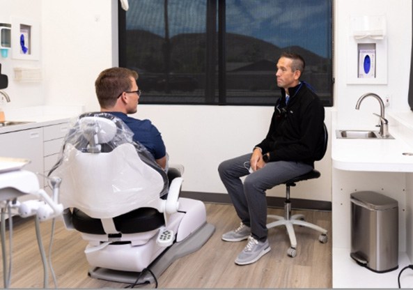 man and woman smiling together in AZ Dental